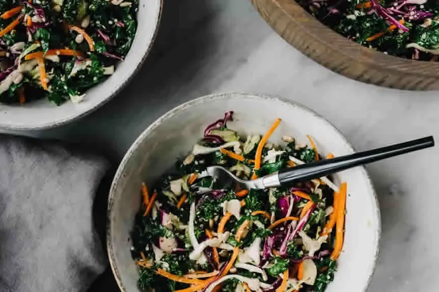 A crunchy broccoli slaw with apple, raisins and sunflower seeds in a creamy dressing