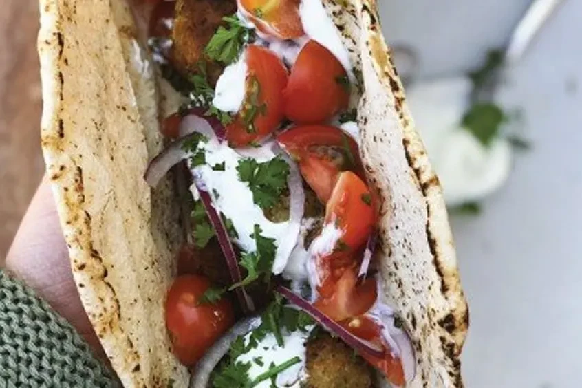 Golden sesame-crusted falafel balls served with a Greek yoghurt sauce