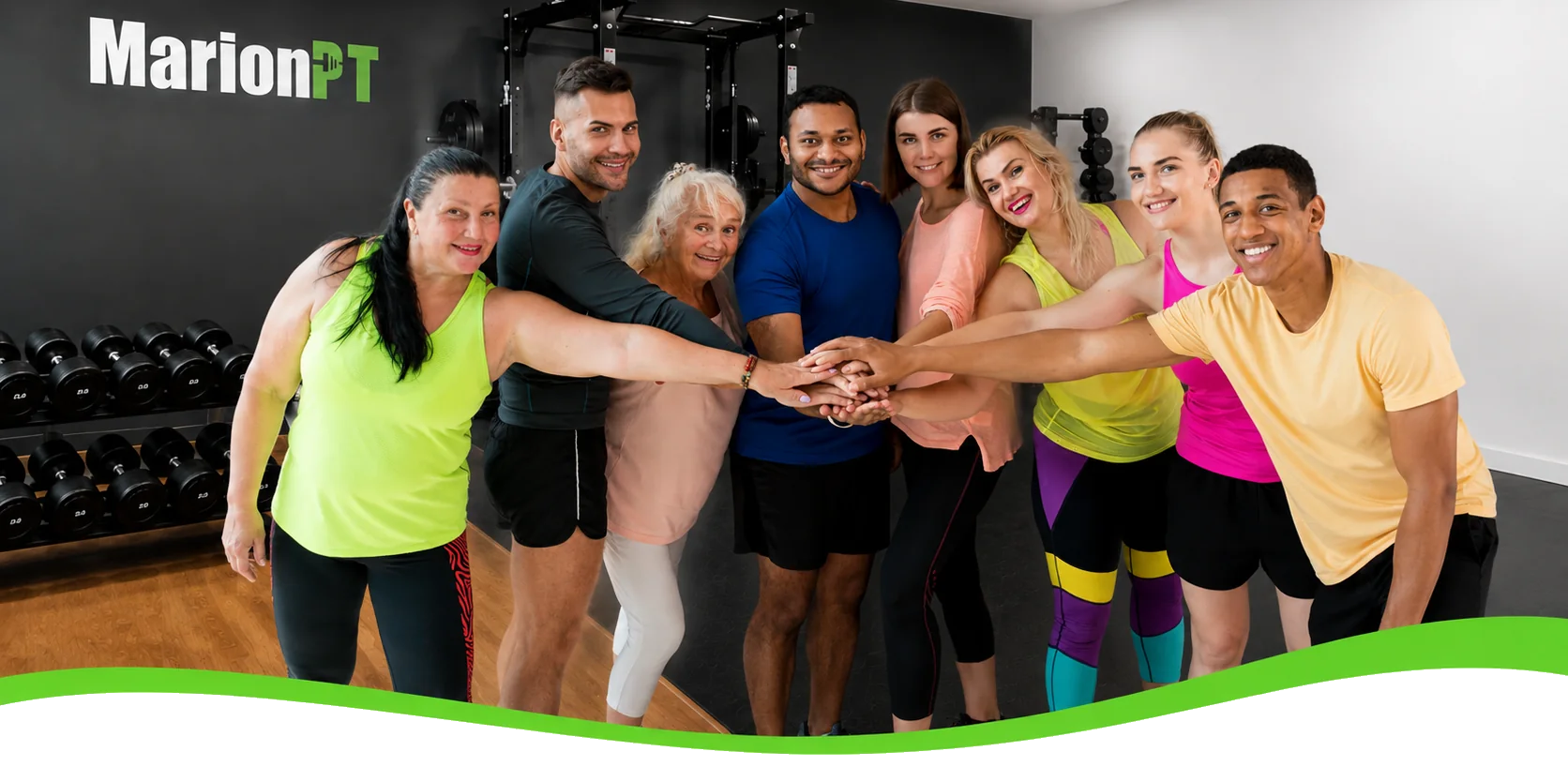 A small group of MarionPT members standing together with hands joined in the Warradale studio